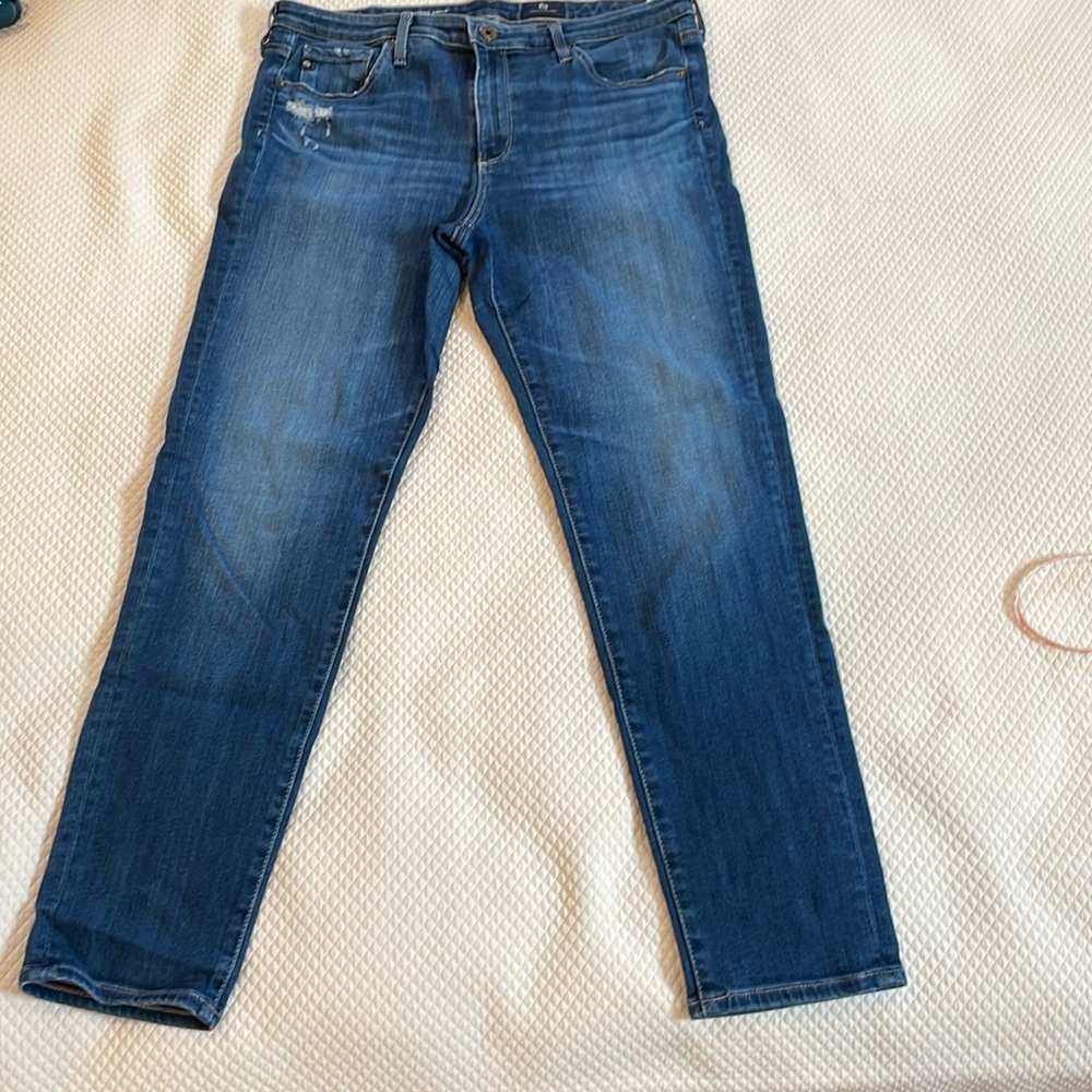AG Stevie ankle jean 31R. Minor distressing at pocket.